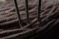 Three sewing needles are inserted into a spool of thread. close-up. Royalty Free Stock Photo