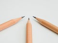 Three Sharp Pencils point to center