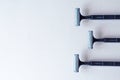 Three shaving machines on a light gray background