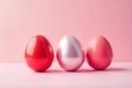 Three shiny easter eggs in a row on pink background a festive springtime image. Generative AI Royalty Free Stock Photo