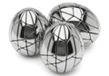 Three shiny metal easter eggs with geometric patterns isolated on white background Royalty Free Stock Photo