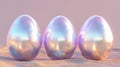 Three shiny metallic eggs rest on a sandy surface, capturing the essence of Easter celebrations and seasonal joy. Royalty Free Stock Photo