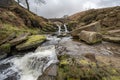 Three Shire Heads. A waterfall and packhorse stone bridge at Three Shires Head in the Peak District National Park Royalty Free Stock Photo