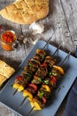 Shish kebab with pita bread ajvar and a garlic bulb Royalty Free Stock Photo