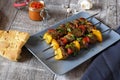 Shish kebab with pita bread ajvar and a garlic bulb Royalty Free Stock Photo