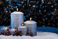 Three Silver Candles in snow