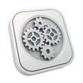 Three silver gears interlocked within a rounded square icon on white mechanism machinery Royalty Free Stock Photo