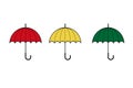 Three simple classic umbrellas of red, yellow and green colours on white background