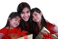 Three sisters holding presents Royalty Free Stock Photo