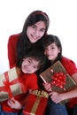 Three sisters holding presents Royalty Free Stock Photo