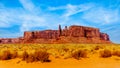 The Three Sisters and Mitchell Mesa, a few of the many massive Red Sandstone Buttes and Mesas in Monument Valley Royalty Free Stock Photo