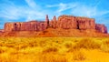 The Three Sisters and Mitchell Mesa, a few of the many massive Red Sandstone Buttes and Mesas in Monument Valley Royalty Free Stock Photo