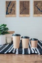 Three sizes of paper cups with coffee, cafe menu, space for your logo Royalty Free Stock Photo