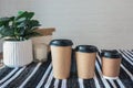 Three sizes of paper cups with coffee, cafe menu, space for your logo Royalty Free Stock Photo