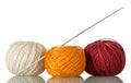 Three skeins of cotton yarn and crochet hook, isolated on white Royalty Free Stock Photo