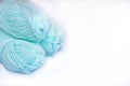 Three skeins of yarn for knitting mint color on a white background, isolation, copy space