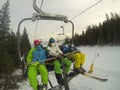 Skiers on a chair lift