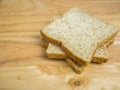 Three slice whole wheat bread on wooden table