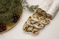 The three slices and the main part of Stollen with Christmas ornaments on a white background. Traditional German Christmas cake Royalty Free Stock Photo