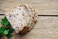Slices of rustic bread with seeds isolated on wooden table or background Royalty Free Stock Photo