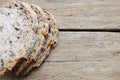 Slices of rustic bread with seeds isolated on wooden table or background Royalty Free Stock Photo