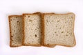 Three slices of white bread on a light table Royalty Free Stock Photo