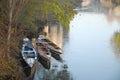 Three small boats moored in the river Bacchiglione in Padova in Veneto (Italy) Royalty Free Stock Photo