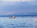 Three small fishing boats trolling for salmon on the coast of Va Royalty Free Stock Photo