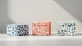 Three Small Gift Boxes with Floral Patterns on White Background Royalty Free Stock Photo