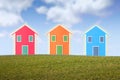 Three small isolated houses on a hill