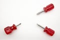 Three small screwdrivers with red handles on a white background Royalty Free Stock Photo