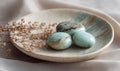 Three small stones are sitting on a white plate Royalty Free Stock Photo
