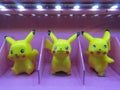 Three small toy of the Japanese anime character Pikachu on display