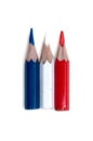 Three small used colored pencils