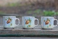 three small white coffee ceramic cups Royalty Free Stock Photo