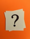 Paper notes with question marks on orange background, flat lay. Space for text Royalty Free Stock Photo