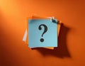 Paper notes with question marks on orange background, flat lay. Space for text Royalty Free Stock Photo