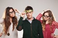 Three smart student friends looking with eyeglasses Royalty Free Stock Photo