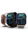 3 smart watches - Apple Watch 4, silver, gold and black, on white