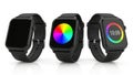 Three smartwatches displaying various colorful screens Royalty Free Stock Photo
