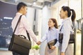 Three smiling business people handshaking outside the office at night Royalty Free Stock Photo