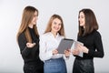 Three smiling business women standing in a row isolated on white background. Business Group people. Happy Business Team. Royalty Free Stock Photo