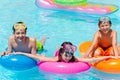 Three Smiling Children in Pool Royalty Free Stock Photo