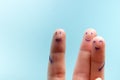 Three smiling fingers that are very happy to be friends. Friendship teamwork concept on blue background with copy space Royalty Free Stock Photo