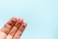Three smiling fingers that are very happy to be friends. Friendship teamwork concept on blue background with copy space Royalty Free Stock Photo