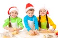 Three smiling kids with Christmas cooking Royalty Free Stock Photo
