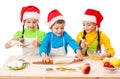 Three smiling kids with Christmas cooking Royalty Free Stock Photo