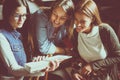 Three students girls learning together at home. Royalty Free Stock Photo