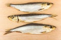 Three smoked fish on board Royalty Free Stock Photo