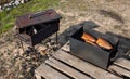 Three smoked fish in a makeshift smokehouse Royalty Free Stock Photo